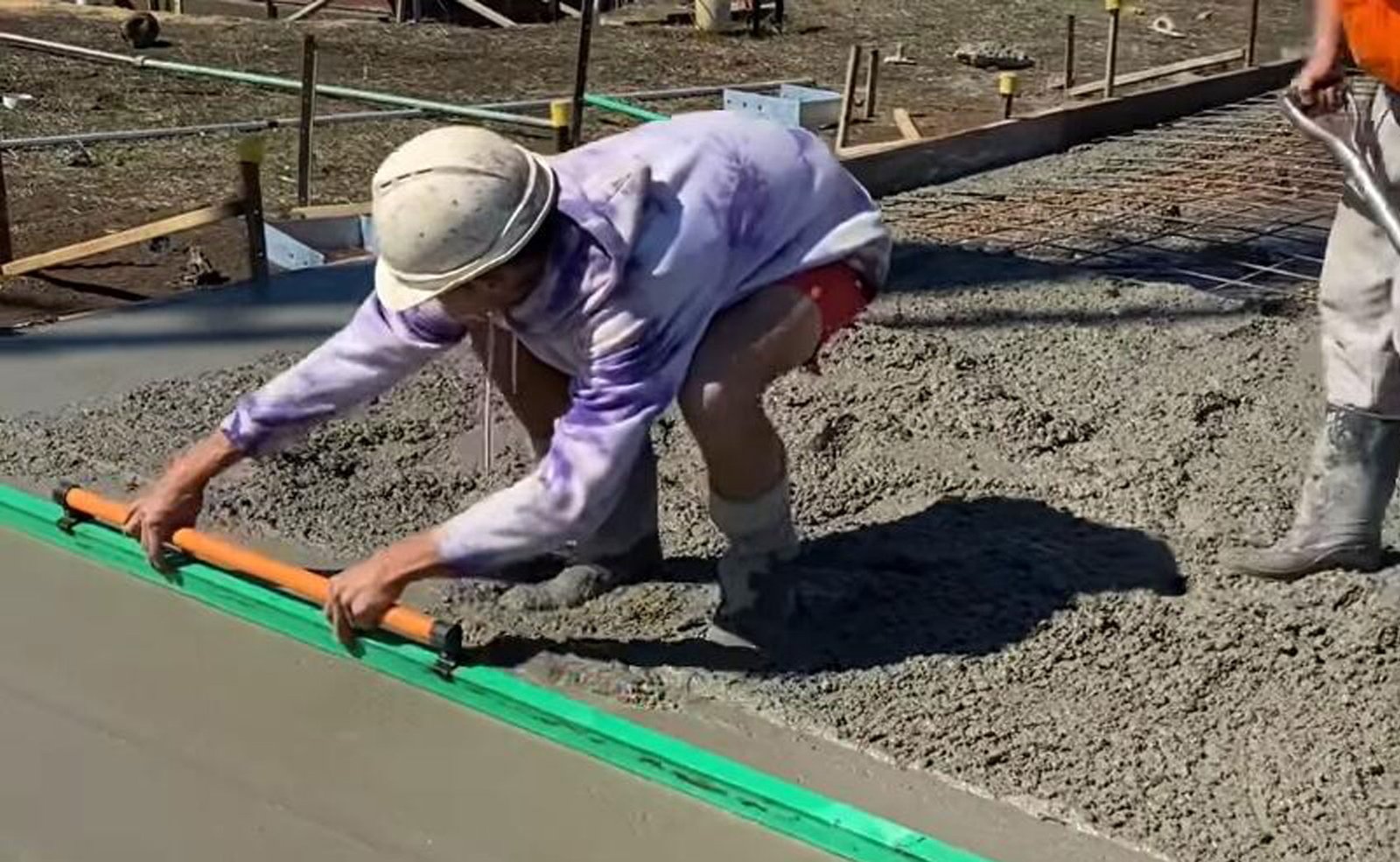 screeding concrete by hand